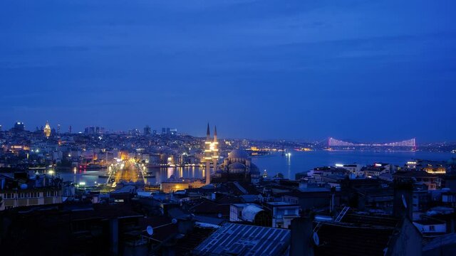 Timelapse Night view of Galata bridge and Tower in Istanbul, Turkey. Galata bridge spans the Golden Horn. Istanbul, Turkey - May 01, 2021