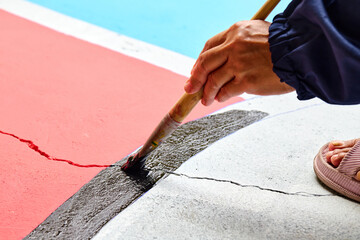 brush colors  on the playground surface 