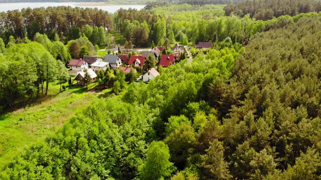 Small Village With Vibrant Green Lush Foliage In Styporc, Chojnice County, Pomeranian Voivodeship In Northern Poland. - Aerial Drone Shot