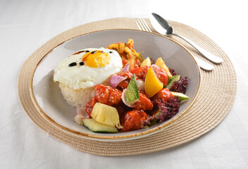popular chef cook fried sweet and sour chicken with vegetables serve with steam white rice asian halal menu