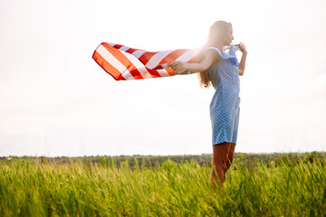4th of July. Fourth of July. Woman  with the national flag. American Flag. Independence Day....