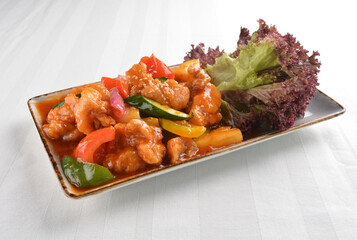 popular chef cook fried sweet and sour chicken with vegetables serve with steam white rice asian halal menu