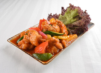 popular chef cook fried sweet and sour chicken with vegetables serve with steam white rice asian halal menu