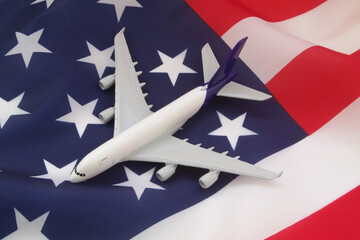 Airplane model on USA flag. Aviation law, travel and transportation in United States concept.