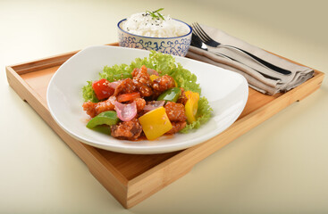 popular chef cook fried sweet and sour chicken with vegetables serve with steam white rice asian halal menu