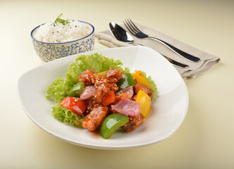 popular chef cook fried sweet and sour chicken with vegetables serve with steam white rice asian halal menu