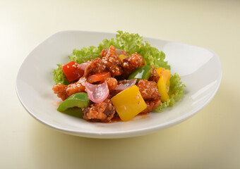 popular chef cook fried sweet and sour chicken with vegetables serve with steam white rice asian halal menu