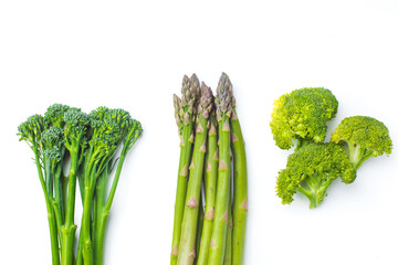 Raw broccolini at the row on white background