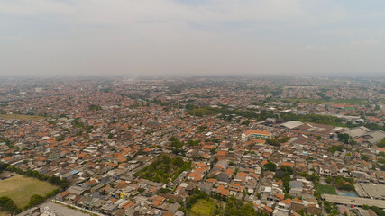 Aerial cityscape densely built asian city. modern city Surabaya with buildings and houses. Surabaya capital city east java, indonesia