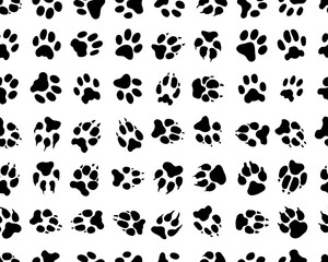 Fototapeta na wymiar Black traces of dogs on a white background, seamless wallpaper 