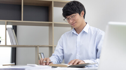 Businessman presses a calculator to calculate earnings and analyze company earnings in his private office, Information in finance and accounting, Company performance and revenue.