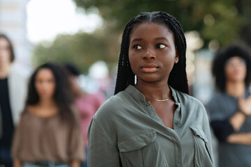 Portrait of young african american woman leading strikers