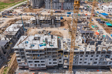 construction of a new house. a concrete multi-storey building in a residential complex.