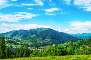Foto op Canvas Nice view of the mountains. A small village at the foot of the mountain. Carpathians. Ukraine. Slavsko. Mountain landscape. Travels. Hiking tours. © vallerato