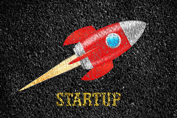 Startup. Word on the pavement. Space rocket. The concept of a new project.