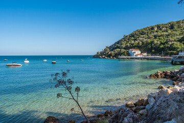 Crystal clear water from the Atlantic Ocean at Portinho da Arrábida, belonging to the natural...