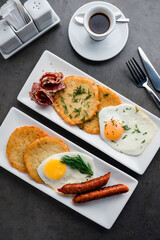english breakfast fried egg with bacon and sausages