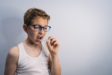 blond guy with glasses gets clear mouth braces