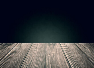 Sales empty table from old patinated planks with black background in grunge style.