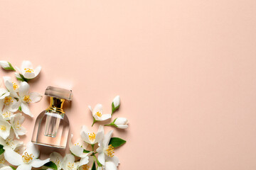 Bottle of luxury perfume and fresh jasmine flowers on beige background, flat lay. Space for text - obrazy, fototapety, plakaty