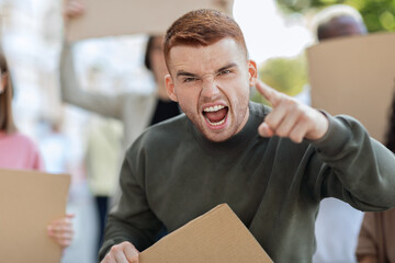 Charismatic young man leading multiracial group of protestors