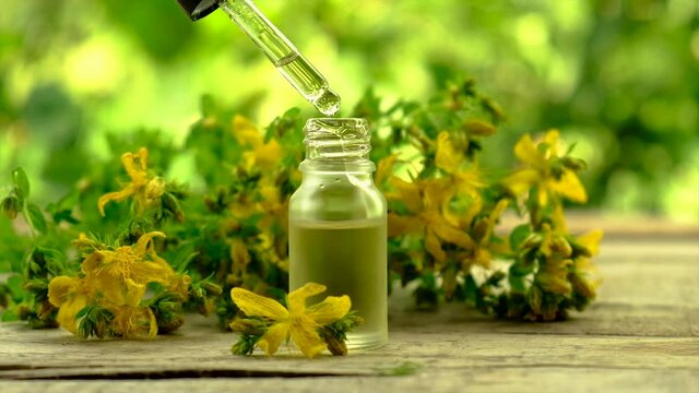 extract and tincture of St. John's wort in a small bottle. Selective focus.
