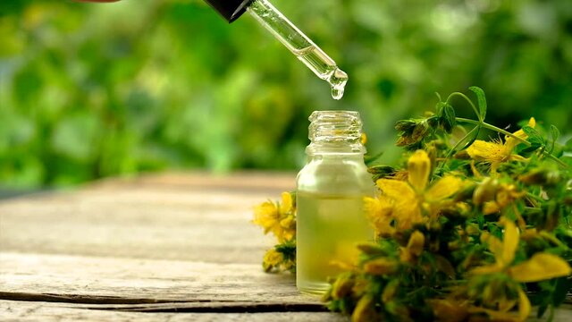 extract and tincture of St. John's wort in a small bottle. Selective focus.