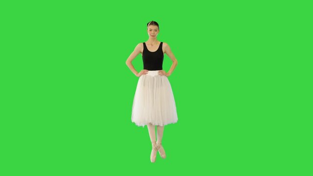 Young ballerina walks en pointe on a Green Screen, Chroma Key.