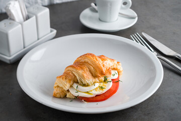 Breakfast Fried eggs, tomato, croissant