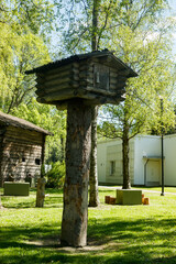 Small tree house made of logs in the forest