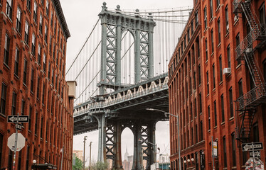 Manhattan Bridge seen from alley in Dumbo, Brooklyn - New York City.