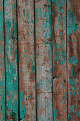 The texture of the background is made of battered wooden boards with peeling paint.