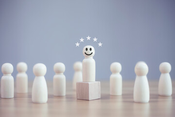 Happy wood person model a smiley among people, best excellent business service rating customer experience, Leadership and 5 star satisfaction concept.