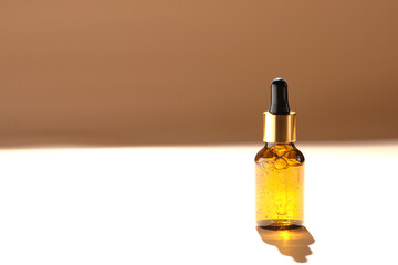 bottle with micellar water, essence of natural oil, serum serum for the face. Brown glass bottle with pipette