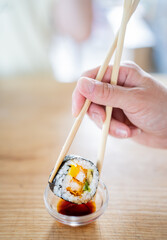 person holding a bowl of rice