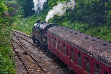 Duffield, Derbyshire, UK, June 22, 2021:Ecclesbourne Railway Steam Railway with Locomotive 80080 departing from Duffield Station on a train service to Wirksworth.