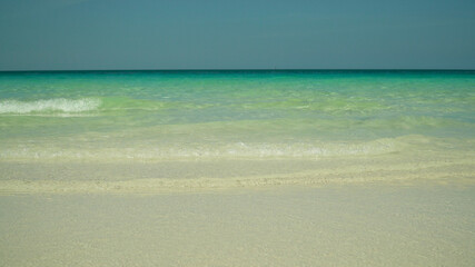 Seascape: blue sea and tropical beach on a background of blue sky. Summer and travel vacation concept. Boracay, Philippines