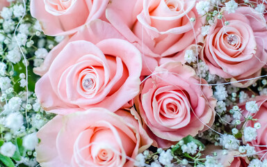 Bouquet of pink roses with small briliants