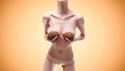 Panoramic image of a woman with braids in her hands. Breast augmentation concept. Plastic surgery.