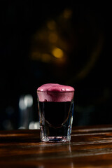Shot of a cocktail with froth