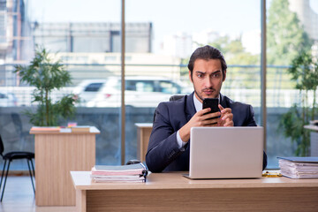 Young businessman employee working in the office