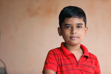 Portrait of Indian little boy posing to camera	
