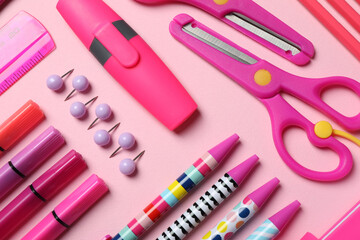 Flat lay composition with stationery on pink background
