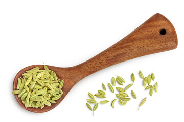 Dried fennel seeds in wooden spoon isolated on white background with clipping path. Top view. Flat lay