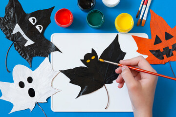Drawing Halloween characters on dry autumn leaves. Step 6