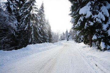 Winter landscape, road covered by snow