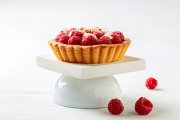 Delicious tartlet with custard and raspberries.