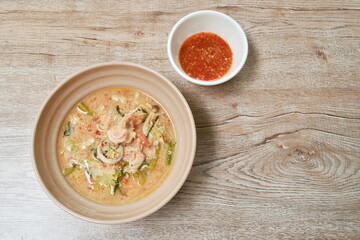 boiled seafood sukiyaki in soup with sauce