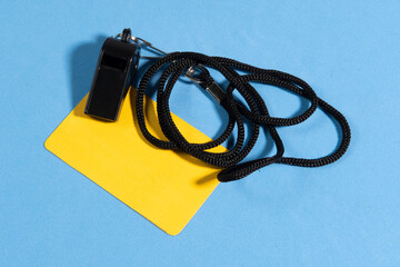 yellow card and referee whistle with space for text