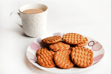 Wheat biscuits in the white plate, Atta biscuit, cookies - close up of a fresh breakfast cookies.